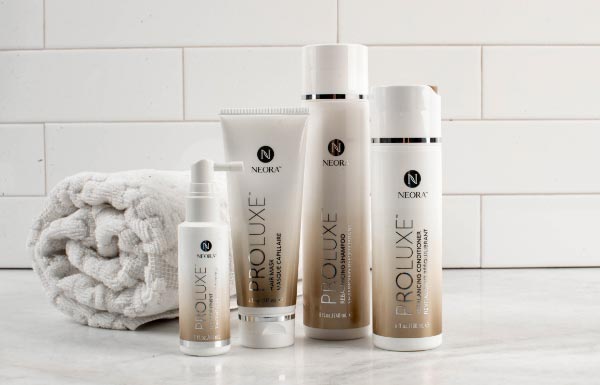 A lifestyle shot of the ProLuxe Hair Care System sitting on a bathroom counter.